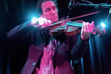 Andrew Bird struggles to keep his eyes open during a violin solo at The Bell House